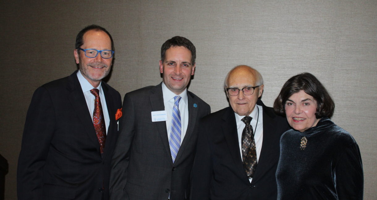 Foundation Board of Directors Chair Scott Christensen and President Andy Patterson join Attorney Howard Paulson and Candy Hanson, former president of the Foundation.