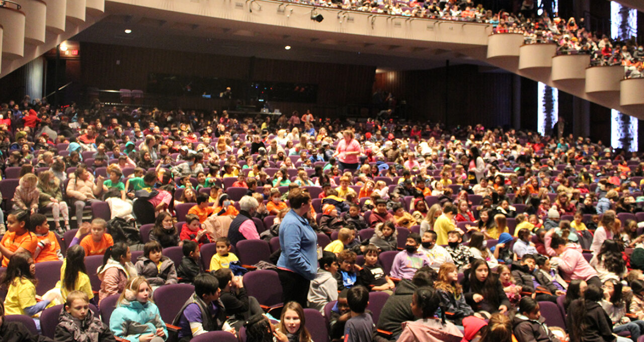 Students wait for "Schoolhouse Rock Live!" to begin.