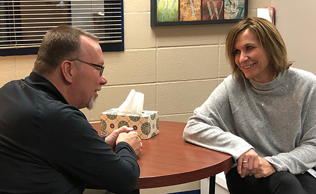Steve Hildebrand visits with Lowell Elementary Principal Diane Kennedy.