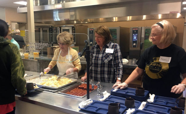 Volunteers serve at the Banquet